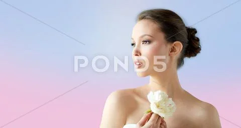 Beautiful asian woman with flower and jewelry Stock Photos