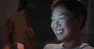 Beautiful Asian Woman Having Late Night Video Chat With Friend Stock Footage