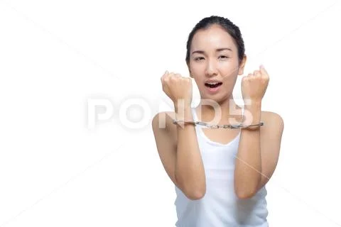 Beautiful Asian woman with pure face and her hand in shackle,She can not make Stock Photos