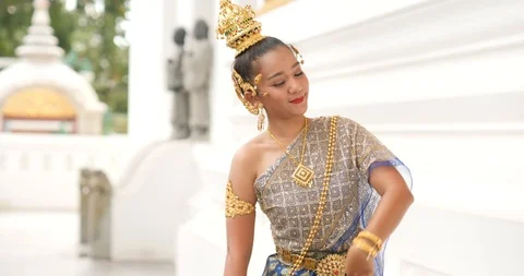 Beautiful asian woman in thai traditional dress dancing traditional thai dance Stock Footage