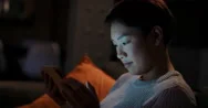 Beautiful Asian Woman Using Digital Tablet Technology At Home Late Night Stock Footage