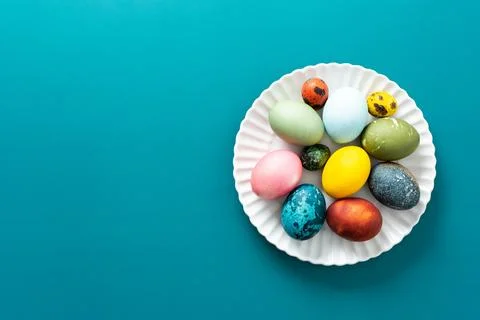 A beautiful assortment of Easter eggs in various colors and patterns is displ Stock Photos