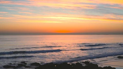 Beautiful Atlantic ocean waves with sunset reflections on water surface at Ca Stock Footage 108912477