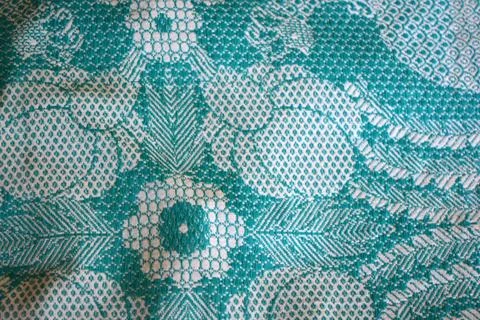 Beautiful authentic Ukrainian pattern on fabric of flowers, leaves, petals. Stock Photos