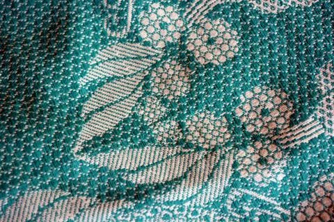 Beautiful authentic Ukrainian pattern on fabric of flowers, leaves, petals. 库存照片