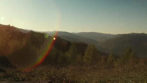 Beautiful autumn forest, blue sky and amazing mountains at sunset Stock Footage 292114331