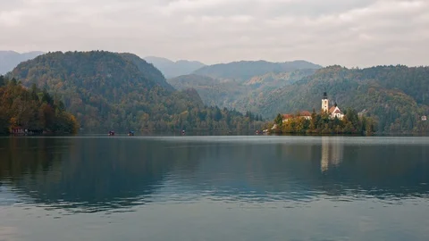 Beautiful autumn landscape around Lake Bled island with Church at Slovenia Stock Footage