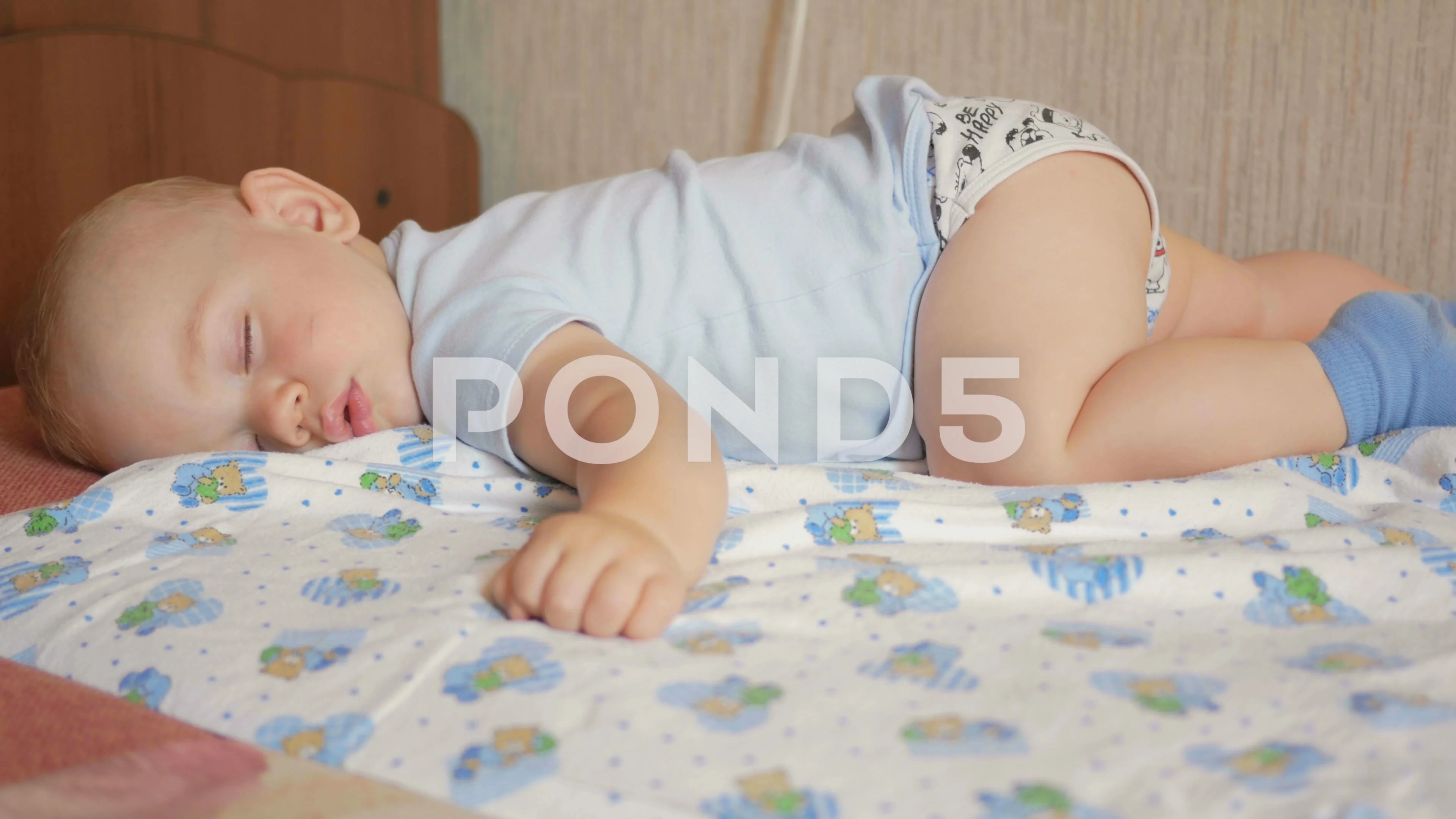 Beautiful baby sleeping in funny pose on... | Stock Video | Pond5