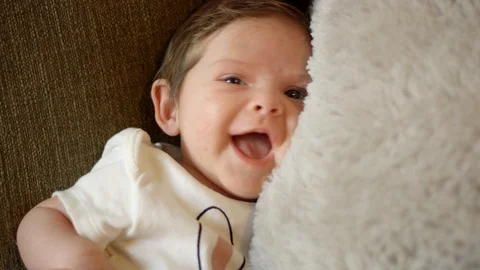 Beautiful baby smiling at the camera Stock Footage 107572206