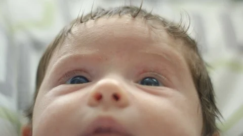Beautiful baby smiling at the camera Stockbeeldmateriaal 107615021