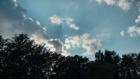 Beautiful background. Blue sky with clouds and sun on summer Stock Footage 169367205