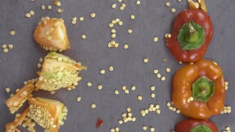 Beautiful background of chopped bell pepper and seeds Stock Footage 116504748