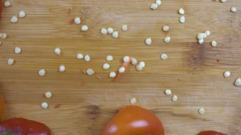 Beautiful background of chopped bell pepper and seeds on a cutting board Stock Footage 116504966