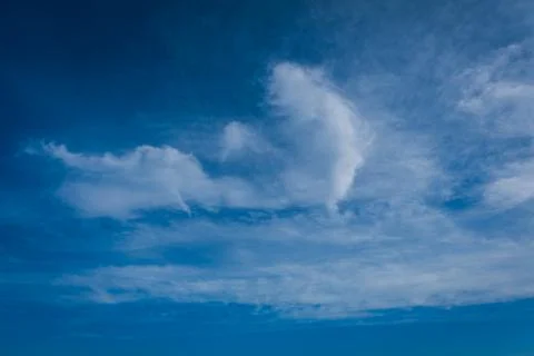 Beautiful background of clouds, clearly visible lines of white clouds and blu Stock Photos