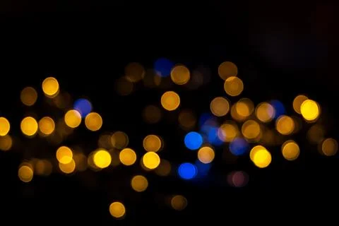 Beautiful background of defocused shiny blue and yellow round circles isolate Stock Photos