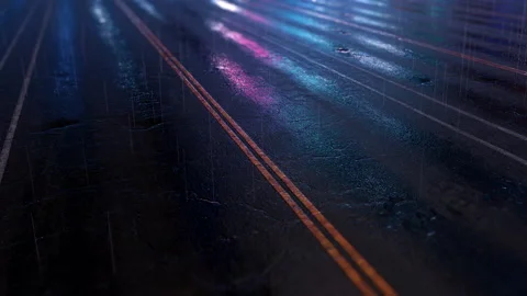 Beautiful background. Reflection of neon city lights in puddles of wet asphalt Stock Footage 144163038