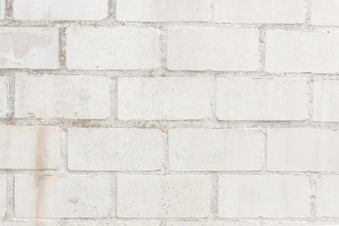 A beautiful background texture of light-colored brickwork in shades of gray a Stock Photos