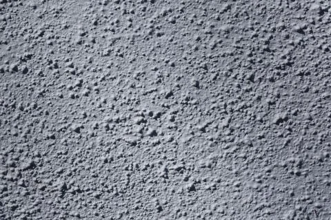 Beautiful background texture of rough bumpy surface. Gray backgrounds. Stock Photos