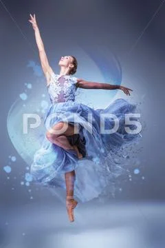 The beautiful ballerina dancing in blue long dress Stock Photos