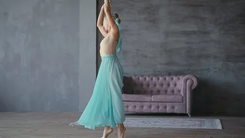 Beautiful ballerina gracefully dancing in the studio Stock Footage 119454367