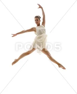 Beautiful ballerina posing in graceful leap Stock Photos