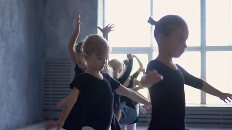 Beautiful ballerinas in black tutus at a ballet lesson. Lovely girls dance at Stock Footage