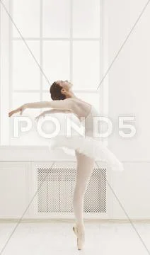 Beautiful ballerine dance in ballet position Stock Photos