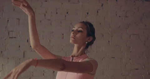 Beautiful ballet movements with his hands. Ballerina in pointe in a white skirt Stock Footage 111990472