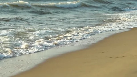 Beautiful Baltic Sea waves lapping on golden sandy shore in coastal view Video stock 311865951