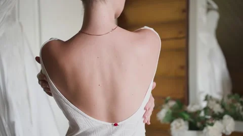 The beautiful bare back of the bride on her wedding day Video stock 329093234
