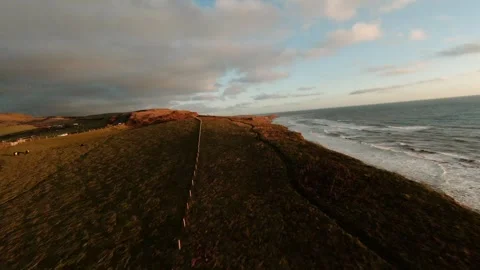 A beautiful beach with a cliff in the background Stock Footage 298249269
