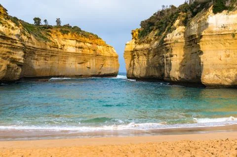 Beautiful beach in lagoon surrounded by cliffs Stock Photos