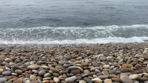 Beautiful Beach with Large Rocks and Rolling Pebbles 🌊 – Relaxing Ocean View Stock Footage 311110128