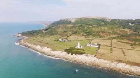 A beautiful beach with a lighthouse in the distance Stock Footage 297950511