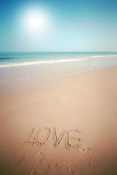 Beautiful beach with sand, blue waves and sky Stock Photos