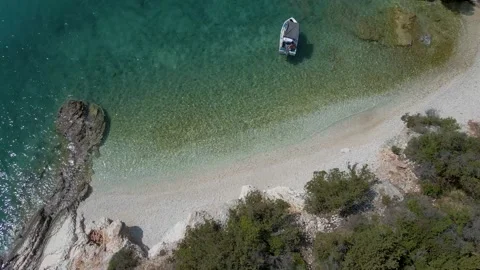 Beautiful beach with a small boat Stock Footage 162678189