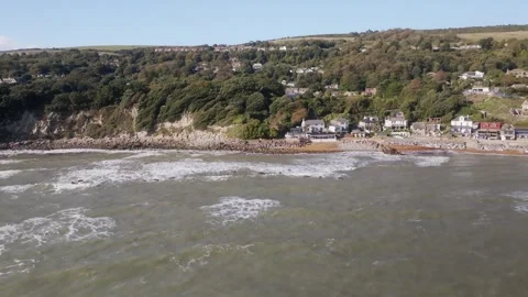 A beautiful beach with a small town in the background Video stock 297077565