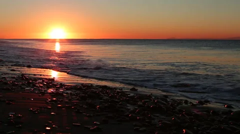 BEAUTIFUL BEACH AT SUNRISE OR SUNSET; CLOSE UP OF WAVES ON SHORE Stock Footage 59072277