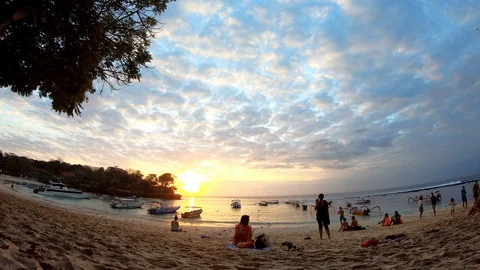 Beautiful Beach Sunset in Indonesia with Lumpy Pink and Orange Clouds Stock Footage 119997046