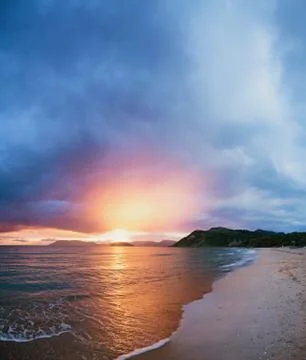 Beautiful beach with sunset Stock Photos