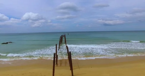 Beautiful beach on the tropical coast, the destroyed pier Stock-Footage 81909448