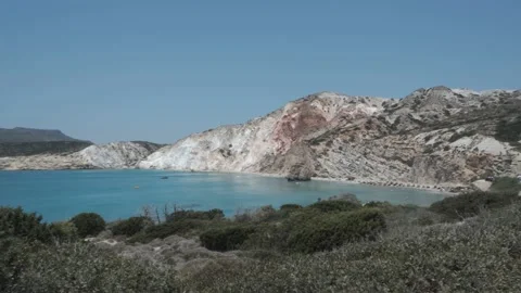 Beautiful Beach Under a Red Mountain, Fyriplaka in Milos, Greece Stock Footage