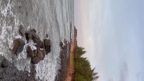 Beautiful beach with waves and rocks in the morning Stock Footage 250954359