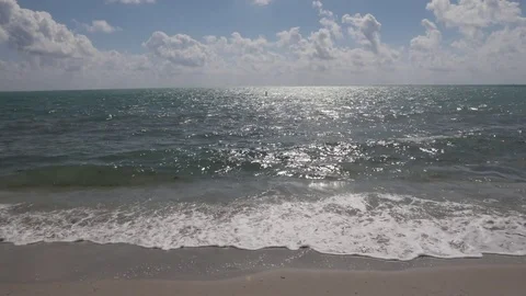 Beautiful Beach with waves and sun and clouds Video stock 83976387