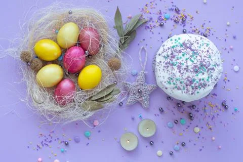 Beautiful beautiful Easter composition in purple tones with painted eggs and  Stock Photos