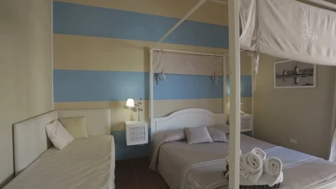 Beautiful bedroom with canopy Stock Footage 87860505