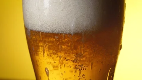 Beautiful beer foam flows down the glass. Light beer. Variant 2 Stock Footage 196887424