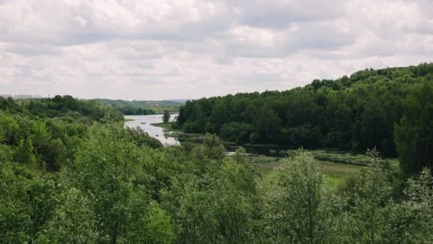 A beautiful bend of the river near the forest. Shooting beautiful nature Stock Footage 290935761
