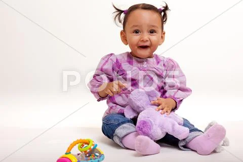 Beautiful biracial baby surprised Stock Photos