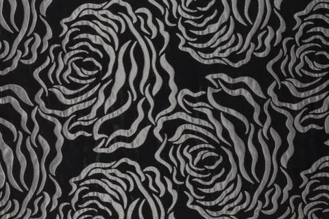 Beautiful black fabric with light pattern and textile texture background Stock Photos